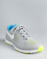 This dynamic minimal-training sneaker features a laser-cut perforation skin and a mesh inner lining for an aesthetically unique high-performance design you'll love to wear whether you're at the gym or kicking around the soccer ball with friends. This dynamic minimal-training sneaker features a laser-cut perforation skin and a mesh inner lining for an aesthetically unique high-performance design you'll love to wear whether you're at the gym or kicking around the soccer ball with friends.