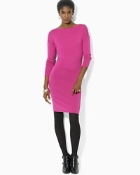 Crafted in merino wool, a timeless sweater dress is updated with a boat neckline and chic dolman sleeves. Crafted in merino wool, a timeless sweater dress is updated with a boat neckline and chic dolman sleeves.