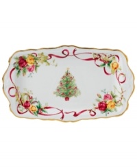 Royal Albert offers a festive twist on a favorite pattern, mixing Christmas trees, holly and bows with pink and gold blooms on the Old Country Roses Holiday tray. Gold-banded porcelain coordinates flawlessly with the original dinnerware collection. Royal Albert offers a festive twist on a favorite pattern, mixing Christmas trees, holly and bows with pink and gold blooms on the Old Country Roses Holiday tray. Gold-banded porcelain coordinates flawlessly with the original dinnerware collection.
