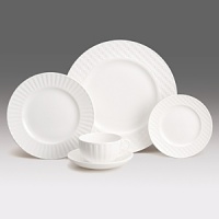 Simple shapes of crisp white are accented with precisely etched lines. Contrasting black matte jasper accessories with glazed interiors are also available. Bone china. Simple shapes of crisp white are accented with precisely etched lines. Contrasting black matte jasper accessories with glazed interiors are also available. Bone china.
