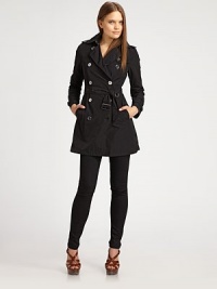 The ultimate lightweight wardrobe essential in rich poplin.Notched collar Long sleeves Epaulettes Double breasted Button front Self belt Side button through pockets Belted cuffs Back yoke Button trim Polyester Dry clean Imported Additional Information Women's Premier Designer & Contemporary Size Guide The ultimate lightweight wardrobe essential in rich poplin.Notched collar Long sleeves Epaulettes Double breasted Button front Self belt Side button through pockets Belted cuffs Back yoke Button trim Polyester Dry clean Imported Additional Information Women's Premier Designer & Contemporary Size Guide