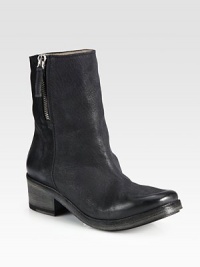 A side zipper adds contemporary style to this classic leather silhouette with a stacked heel. Stacked heel, 2 (50mm)Shaft, 7Leg circumference, 11Leather upperSide zipLeather liningRubber solePadded insoleMade in Italy A side zipper adds contemporary style to this classic leather silhouette with a stacked heel. Stacked heel, 2 (50mm)Shaft, 7Leg circumference, 11Leather upperSide zipLeather liningRubber solePadded insoleMade in Italy