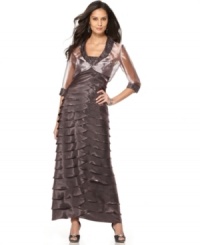 A sheer, luminous jacket with a solid beaded collar and cuff adds a luxe luster to this tiered evening gown by Alex Evenings. A sheer, luminous jacket with a solid beaded collar and cuff adds a luxe luster to this tiered evening gown by Alex Evenings.