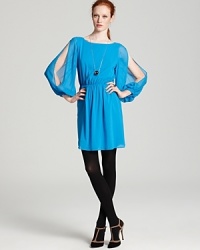 Dramatic split sleeves make a style statement, while a bold blue shines bright on this Alice + Olivia Tasha dress. Dramatic split sleeves make a style statement, while a bold blue shines bright on this Alice + Olivia Tasha dress.