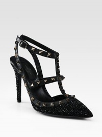 This signature t-strap pump goes uptown with glittery crystals, leather accents and edgy metal studs. Crystal-coated heel, 4¼ (110mm)Crystal coated fabric and leather upper with metal studsPoint toeAdjustable leather ankle strap with metal studsLeather lining and solePadded insoleMade in Italy This signature t-strap pump goes uptown with glittery crystals, leather accents and edgy metal studs. Crystal-coated heel, 4¼ (110mm)Crystal coated fabric and leather upper with metal studsPoint toeAdjustable leather ankle strap with metal studsLeather lining and solePadded insoleMade in Italy