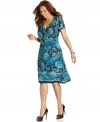 Wrap up a slenderizing look with Elementz' short sleeve plus size dress-- it's ideal for desk to dinner style!