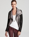 Embrace the versatile nature of this uber-stylish leather Doma jacket that features contrast sleeves that may be detached, converting this edgy-modern jacket to a chic zip-front vest.