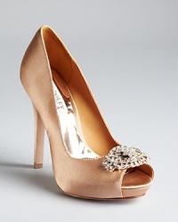 Dazzling rhinestones decorate the toe of Badgley Mischka's Goodie pumps, a satin style for sophisticated evenings. Dazzling rhinestones decorate the toe of Badgley Mischka's Goodie pumps, a satin style for sophisticated evenings.