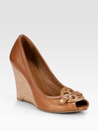 Pebbled leather classic has a stacked wedge, peep toe and oversized logo emblem. Stacked wedge, 4 (100mm)Leather upperLeather liningRubber solePadded insoleImportedOUR FIT MODEL RECOMMENDS ordering true size. Pebbled leather classic has a stacked wedge, peep toe and oversized logo emblem. Stacked wedge, 4 (100mm)Leather upperLeather liningRubber solePadded insoleImportedOUR FIT MODEL RECOMMENDS ordering true size.