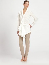 A sculptural front drape elevates the classic shirt-tailored style, in crisply woven paper cotton.Point collarLong sleeves with button cuffsGathered front drape with concealed button closureSide slash pocketsCurved back hemAbout 30 from shoulder to hemCottonDry cleanImported of Italian fabricModel shown is 5'10 (177cm) wearing US size 4. A sculptural front drape elevates the classic shirt-tailored style, in crisply woven paper cotton.Point collarLong sleeves with button cuffsGathered front drape with concealed button closureSide slash pocketsCurved back hemAbout 30 from shoulder to hemCottonDry cleanImported of Italian fabricModel shown is 5'10 (177cm) wearing US size 4.