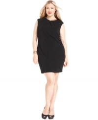 A glimmer of gold at the neckline of this plus size Calvin Klein dress adds panache to the sleeveless sheath silhouette. A glimmer of gold at the neckline of this plus size Calvin Klein dress adds panache to the sleeveless sheath silhouette.