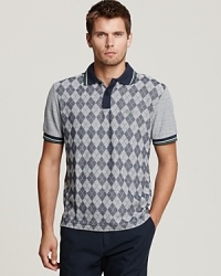 BOSS Green offsets the argyle panel on the slim fit polo with solid sleeves and contrast trim at the collar, placket and sleeves. BOSS Green offsets the argyle panel on the slim fit polo with solid sleeves and contrast trim at the collar, placket and sleeves.