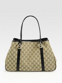 GG fabric with leather trim and interlocking GG ornaments.Double top handles, 7½ drop Snap-strap closure in middle of bag Protective metal feet One inside zip pocket Two inside open pockets Linen lining 14W X 9H X 4;D Made in Italy GG fabric with leather trim and interlocking GG ornaments.Double top handles, 7½ drop Snap-strap closure in middle of bag Protective metal feet One inside zip pocket Two inside open pockets Linen lining 14W X 9H X 4;D Made in Italy