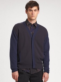 The classic cardigan with a decidedly right-now look. Concealed button frontSlash pocketsAbout 29 from shoulder to hemMerino woolDry cleanImported of Italian fabric The classic cardigan with a decidedly right-now look. Concealed button frontSlash pocketsAbout 29 from shoulder to hemMerino woolDry cleanImported of Italian fabric