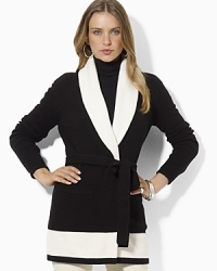 A soft cotton-blend cardigan is knit with a heritage-inspired shawl collar and finished with a flattering belted waist. A soft cotton-blend cardigan is knit with a heritage-inspired shawl collar and finished with a flattering belted waist.