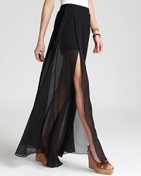 This trend-perfect GUESS skirt features an interior mini skirt with a floor-sweeping sheer overlay, creating a hyper-modern silhouette. This trend-perfect GUESS skirt features an interior mini skirt with a floor-sweeping sheer overlay, creating a hyper-modern silhouette.