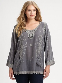 Whimsically designed, an exquisite tunic featuring pretty embroidery, eyelet details and a fit you will love.Round neckLong sleevesEmbroidered detailsFront pocketsAbout 30 from shoulder to hemRayonMachine washImported