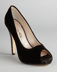 These elegant velvet peep toe pumps possess rocker edge, with rhinestone-studded heels and touches of lace; from Caparros. These elegant velvet peep toe pumps possess rocker edge, with rhinestone-studded heels and touches of lace; from Caparros.