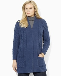 Rendered in a cozy lambswool blend, a chic open-front cardigan is knit in a classic cable stitch. Rendered in a cozy lambswool blend, a chic open-front cardigan is knit in a classic cable stitch.
