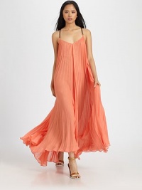 Timeless pleating, criss-cross straps and a lengthy, goddess-like silhouette define this stunning v-neck. V-neckBack criss-cross spaghetti strapsFully linedAbout 42 from natural waistPolyesterDry cleanImportedModel shown is 5'10 (177cm) wearing US size Small. Timeless pleating, criss-cross straps and a lengthy, goddess-like silhouette define this stunning v-neck. V-neckBack criss-cross spaghetti strapsFully linedAbout 42 from natural waistPolyesterDry cleanImportedModel shown is 5'10 (177cm) wearing US size Small.
