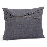 An asymmetrical pleat and zipper adds rock and roll edge to this blue denim decorative pillow. An asymmetrical pleat and zipper adds rock and roll edge to this blue denim decorative pillow.