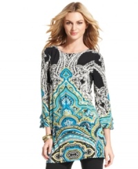 Alfani's tunic is outfitted with a spirited print and stylish touches like triple-tiered cuffs. Alfani's tunic is outfitted with a spirited print and stylish touches like triple-tiered cuffs.