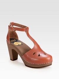Hand-made and artfully crafted, channel '70s vibes with this leather t-strap with an adjustable ankle strap and wooden heel. Wooden heel, 3½ (90mm)Wooden platform, 1 (25mm)Compares to a 2½ heel (65mm)Leather upperWooden liningRubber soleMade in ItalyOUR FIT MODEL RECOMMENDS ordering true whole size; ½ sizes should order the next whole size up. Hand-made and artfully crafted, channel '70s vibes with this leather t-strap with an adjustable ankle strap and wooden heel. Wooden heel, 3½ (90mm)Wooden platform, 1 (25mm)Compares to a 2½ heel (65mm)Leather upperWooden liningRubber soleMade in ItalyOUR FIT MODEL RECOMMENDS ordering true whole size; ½ sizes should order the next whole size up.