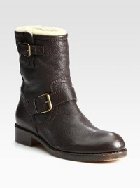 Adjustable buckle straps add some edge to this casual, shearling-lined staple, crafted in Italy of fine leather. Stacked heel, 1¼ (30mm)Shaft, 7½Leg circumference, 9Leather upperSide zipAdjustable buckle strapsShearling liningLeather solePadded insoleMade in Italy Adjustable buckle straps add some edge to this casual, shearling-lined staple, crafted in Italy of fine leather. Stacked heel, 1¼ (30mm)Shaft, 7½Leg circumference, 9Leather upperSide zipAdjustable buckle strapsShearling liningLeather solePadded insoleMade in Italy