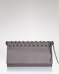 Toughen up your after-hours line up with Oryany's braided leather clutch. In a crave-worthy shape and pared-down palette, this bag loves your darkest dresses and boots.