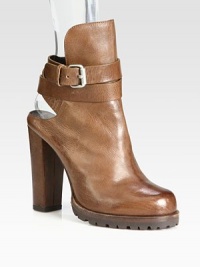 A classic shearling-lined mule is updated with a towering heel and wrap-around ankle strap. Self-covered heel, 4½ (115mm)Covered platform, ½ (15mm)Compares to a 4 heel (100mm)Distressed leather upperWrap-around adjustable ankle strapLeather liningRubber trek solePadded insoleMade in Italy A classic shearling-lined mule is updated with a towering heel and wrap-around ankle strap. Self-covered heel, 4½ (115mm)Covered platform, ½ (15mm)Compares to a 4 heel (100mm)Distressed leather upperWrap-around adjustable ankle strapLeather liningRubber trek solePadded insoleMade in Italy