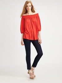 Soft matte jersey drapes off the shoulders in a swingy silhouette.Ruched necklineThree-quarter sleevesAbout 27 from shoulder to hem95% rayon/5% spandexDry cleanMade in USAModel shown is 5'9½ (176cm) wearing US size Small. Soft matte jersey drapes off the shoulders in a swingy silhouette.Ruched necklineThree-quarter sleevesAbout 27 from shoulder to hem95% rayon/5% spandexDry cleanMade in USAModel shown is 5'9½ (176cm) wearing US size Small.