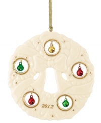 Combining sculpted ivory porcelain with gold trim and colorful jingle bells, this 2012 Lenox wreath ornament strikes a perfect balance between timeless style and festive spirit. Combining sculpted ivory porcelain with gold trim and colorful jingle bells, this 2012 Lenox wreath ornament strikes a perfect balance between timeless style and festive spirit.