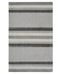 Linear designs are accented with exotic faux silk to create a timeless palette in the Sahara area rug from Calvin Klein. Crafted by skilled artisans in India, it features generously thick wool and viscose fibers woven to create remarkable strength and impeccable elegance.