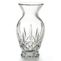 This elegant crystal creation features a sloping neck, along with intricate detailing associated with the Lismore line. Creates a classically beautiful display when accompanied by traditional roses; adds a certain sophistication when paired with fresh cut flowers.. the quintessential crystal vase. This elegant crystal creation features a sloping neck, along with intricate detailing associated with the Lismore line. Creates a classically beautiful display when accompanied by traditional roses; adds a certain sophistication when paired with fresh cut flowers.. the quintessential crystal vase.