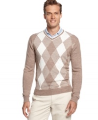 Traditional argyle golf sweater by Greg Norman for Tasso Elba Golf will keep you warm during early tee times. Traditional argyle golf sweater by Greg Norman for Tasso Elba Golf will keep you warm during early tee times.