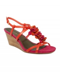 Flirty, feminine and totally flawless. Bandolino's Ginelle wedge features striking flower detail that adds a stroke of flair in the heat. Flirty, feminine and totally flawless. Bandolino's Ginelle wedge features striking flower detail that adds a stroke of flair in the heat.