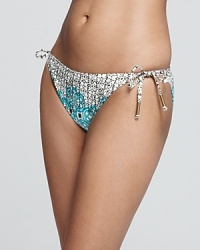 A teal ikat print bands together with a vintage-inspired floral on this vacation-ready Ella Moss bikini bottom. A teal ikat print bands together with a vintage-inspired floral on this vacation-ready Ella Moss bikini bottom.