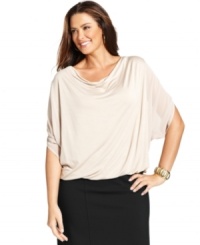 Elegant draping beautifully highlights Alfani's dolman sleeve plus size top, finished by a bubble hem. (Clearance) Elegant draping beautifully highlights Alfani's dolman sleeve plus size top, finished by a bubble hem. (Clearance)