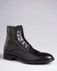 Hold your ground in these polished leather boots from Two Boot New York, a solid addition to your dressed-up wardrobe. Hold your ground in these polished leather boots from Two Boot New York, a solid addition to your dressed-up wardrobe.