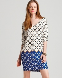 Featuring contrasting hues and a unique geometric print, this versatile Tibi dress masters standout style this season. Embolden the look with a pair of red pumps and tough-luxe bangles. Featuring contrasting hues and a unique geometric print, this versatile Tibi dress masters standout style this season. Embolden the look with a pair of red pumps and tough-luxe bangles.