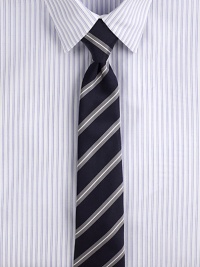 Trim stripes, pared in width to balance the cut of modern suits and jackets.Silk/cotton Dry clean Made in USA