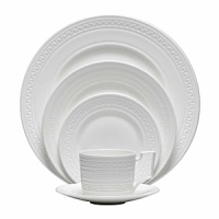 Urban chic and elegance are the hallmarks of the new Intaglio collection from Wedgwood, yet drawing its design inspiration from the delicate embossing of the Georgian era, the fresh white color way is crisp, clean and contemporary. Intaglio highlights the traditional skills of knurling and engine turning, the arts of indenting designs in wet clay to give a distinctive tactile finish. The designs are unique across all the pieces and bring an intricate web of fresh but understated silhouette to the table. Urban chic and elegance are the hallmarks of the new Intaglio collection from Wedgwood, yet drawing its design inspiration from the delicate embossing of the Georgian era, the fresh white color way is crisp, clean and contemporary. Intaglio highlights the traditional skills of knurling and engine turning, the arts of indenting designs in wet clay to give a distinctive tactile finish. The designs are unique across all the pieces and bring an intricate web of fresh but understated silhouette to the table.