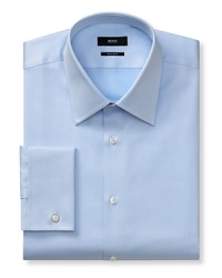 Slightly trimmer than regular fit, button front long-sleeved shirt. Voluminous Kent collar. French cuffs. Flat back yoke with no pleats. Clean front, no pocket. Rounded hem. Textured solid. Slightly trimmer than regular fit, button front long-sleeved shirt. Voluminous Kent collar. French cuffs. Flat back yoke with no pleats. Clean front, no pocket. Rounded hem. Textured solid.