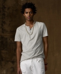 A wear-it-anywhere Henley in lightweight cotton jersey features weathered tribal prints and vintage metal studs for an outdoor-meets-urban vibe. A wear-it-anywhere Henley in lightweight cotton jersey features weathered tribal prints and vintage metal studs for an outdoor-meets-urban vibe.