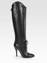 Towering high-heel boot of Italian leather, with a lace-up front and asymmetrical silhouette. Self-covered heel, 4½ (115mm)Shaft, 19Leg circumference, 13½Leather upperLace-up front with back zipBack strap with snap closureLeather lining and solePadded insoleMade in Italy Towering high-heel boot of Italian leather, with a lace-up front and asymmetrical silhouette. Self-covered heel, 4½ (115mm)Shaft, 19Leg circumference, 13½Leather upperLace-up front with back zipBack strap with snap closureLeather lining and solePadded insoleMade in Italy