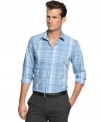 A lightweight plaid pattern captures modern cool and seasonal style with this poplin shirt from Calvin Klein. (Clearance)