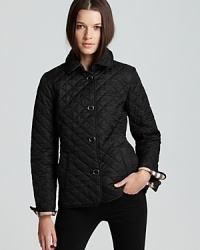 Burberry Brit takes the classic approach to chic everyday outerwear in this flattering quilted jacket. Pair with all your favorite winter wares. Burberry Brit takes the classic approach to chic everyday outerwear in this flattering quilted jacket. Pair with all your favorite winter wares.