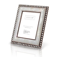 Evoking classic Hollywood glamour, this boudoir frame is meticulously handcrafted of precious mother of pearl and genuine Swarovski crystals with a unique color tone. Fully detailed floral back uses metal and enamel and also features more handset crystals. Evoking classic Hollywood glamour, this boudoir frame is meticulously handcrafted of precious mother of pearl and genuine Swarovski crystals with a unique color tone. Fully detailed floral back uses metal and enamel and also features more handset crystals.