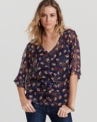 Channel bohemian cool in this Ella Moss top, decorated in a pretty floral print and finished with a waist-cinching tie. Channel bohemian cool in this Ella Moss top, decorated in a pretty floral print and finished with a waist-cinching tie.