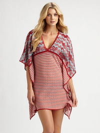 A striking coverup that is sure to make a fashionable first impression.V-neckFlutter sleevesPull-on styleRayon/cottonDry cleanMade in Italy of imported fabric A striking coverup that is sure to make a fashionable first impression.V-neckFlutter sleevesPull-on styleRayon/cottonDry cleanMade in Italy of imported fabric